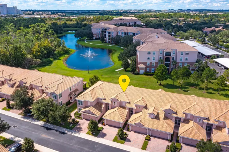 Aerial view with the pond behind the home