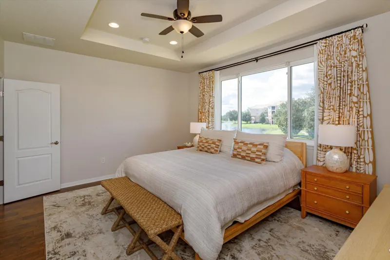 Primary bedroom with pond view
